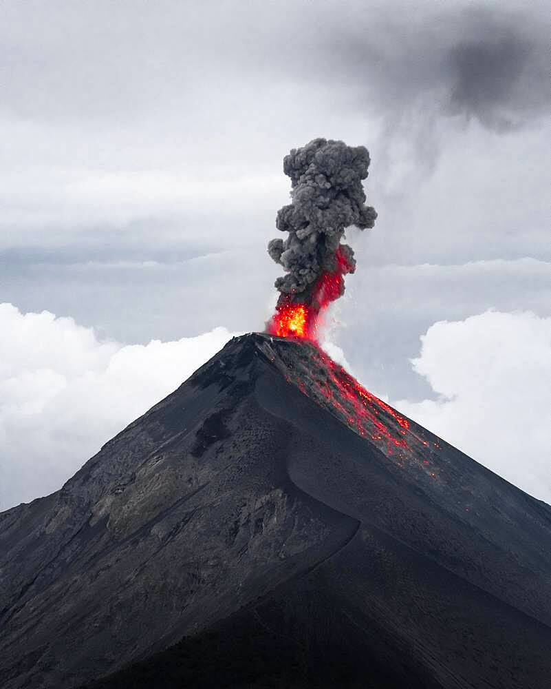 Glowing lava and smoke spitting volcano, volcanic eruption, Volcan de Fuego, Guatemala, Central America