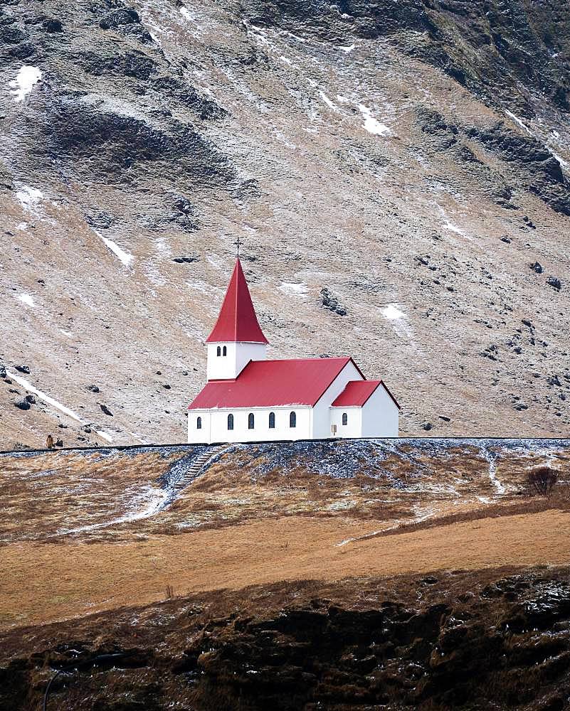 Small church with red roof in Vik from a distance, Vik, Iceland, Europe