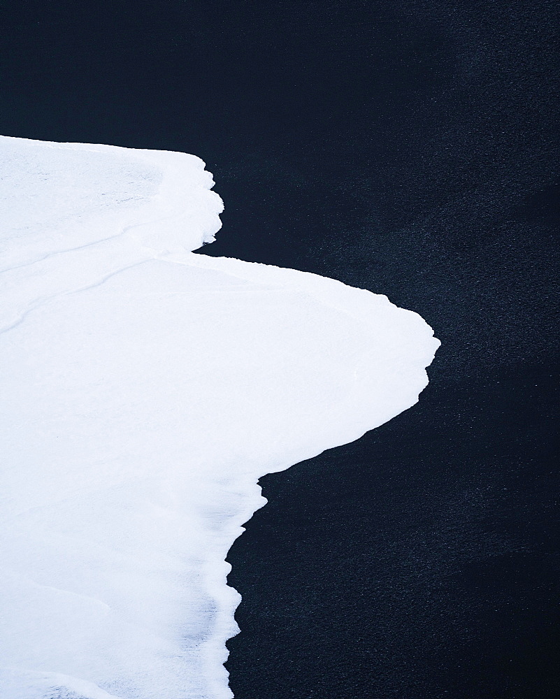 White wave on black lava sand, natural structures, Vik beach, Iceland, Europe