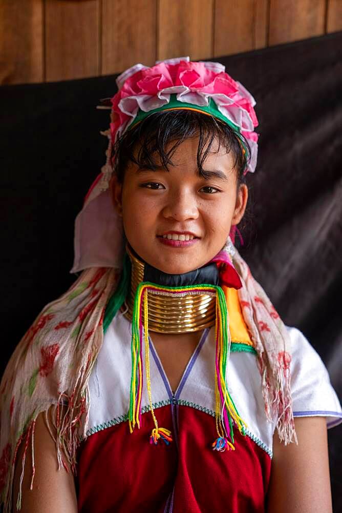 Young long necked woman with several brass rings around her neck, Lake Inle, Myanmar, Asia