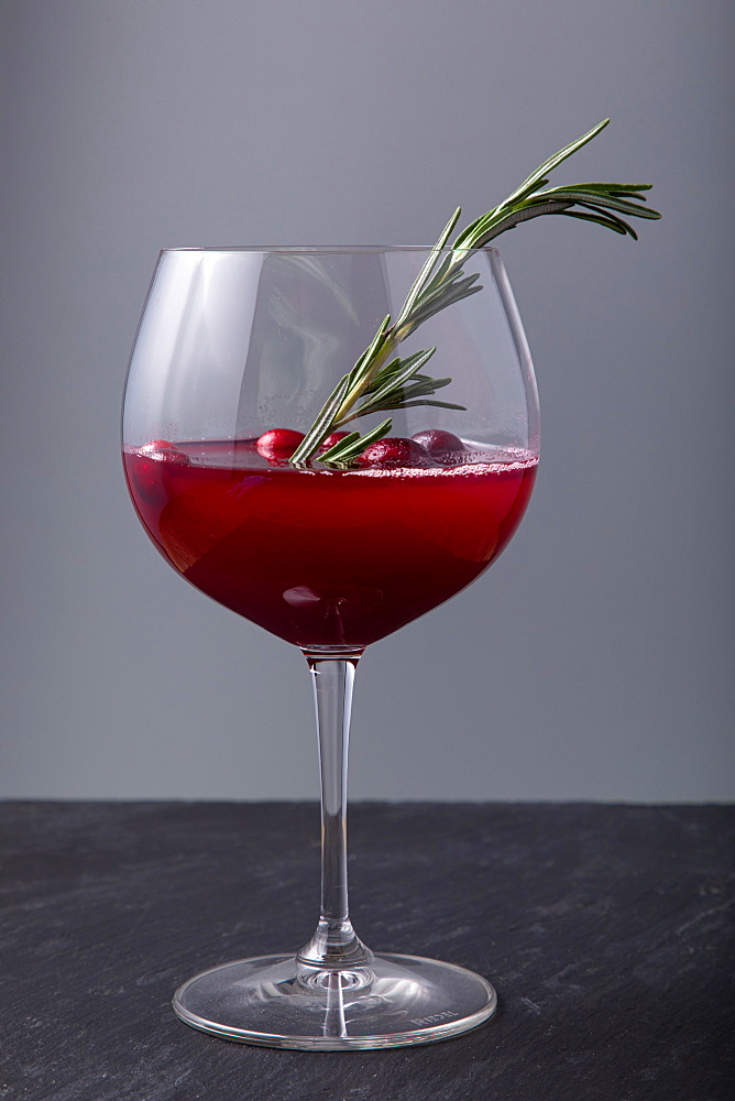 Cranberry cocktail on black surface