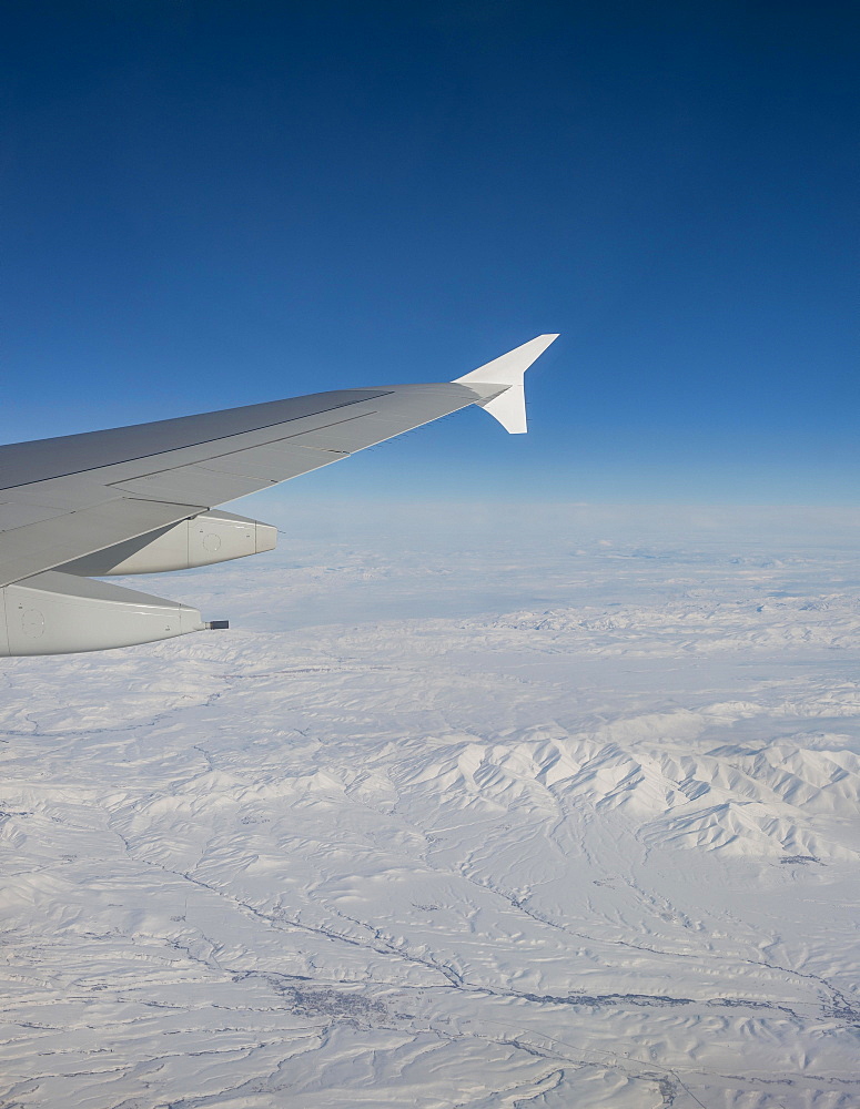 View of mountains and snowy landscape from the airplane, airplane wing of an Airbus A380, aerial view, Anatolia, Northeastern Turkey, Turkey, Asia