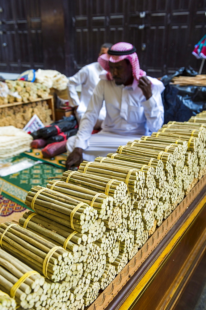 Man selling chewing sticks, old town of Jeddah, Saudi Arabia, Asia