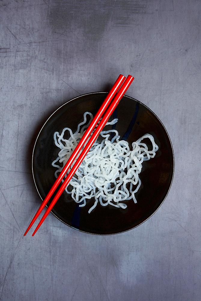 Shirataki noodles made from konjac flour in a bowl with chopsticks, Germany, Europe