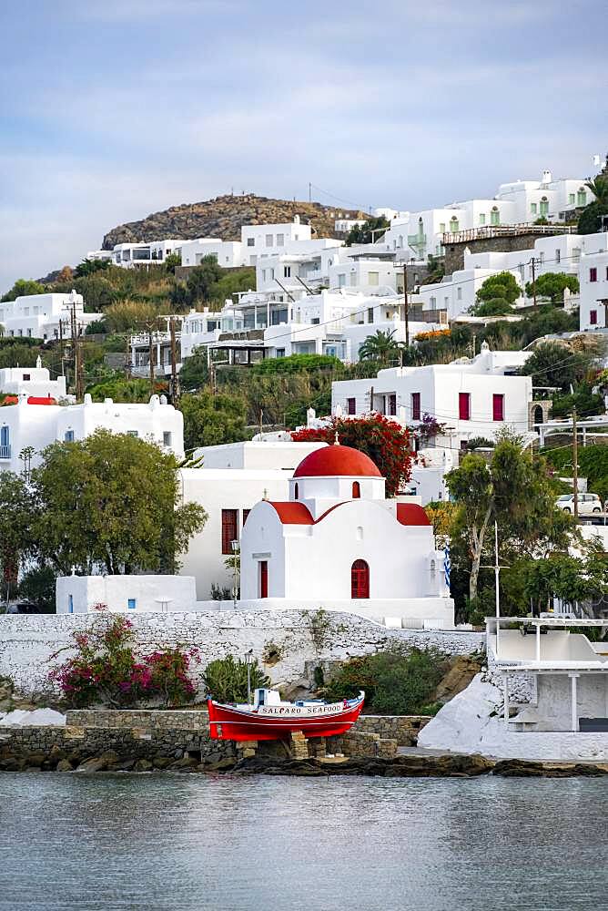 Fishing boat and small Greek Orthodox white church with red roof, Old Port of Mykonos, Chora, Mykonos Town, Mykonos, Cyclades, Aegean Sea, Greece, Europe