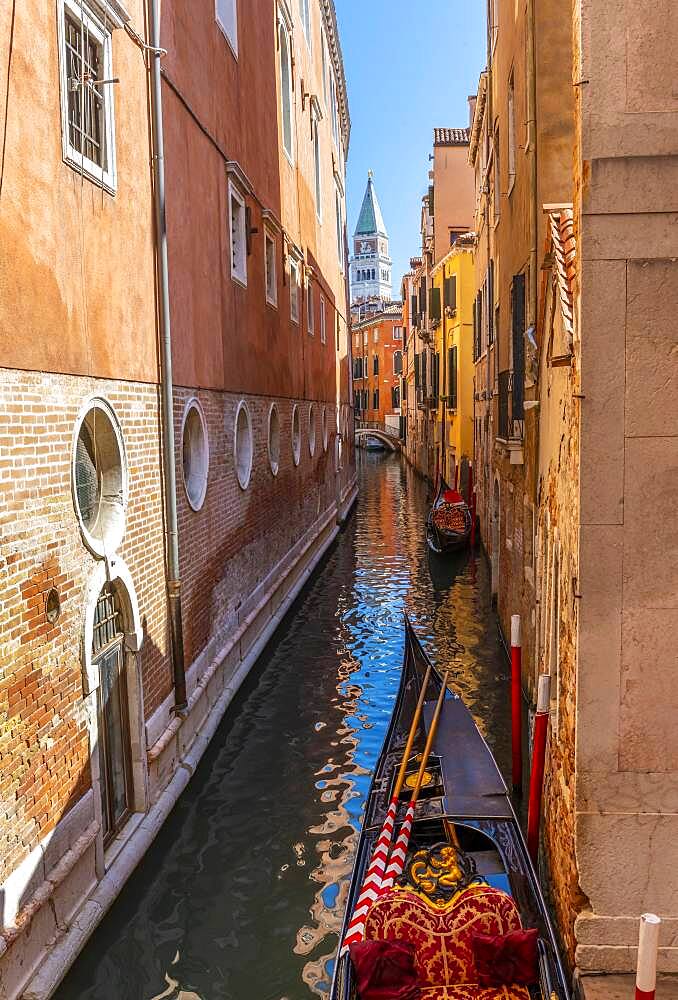 Narrow canal with gondola, view of Campanile di San Marco bell tower, Venice, Veneto, Italy, Europe