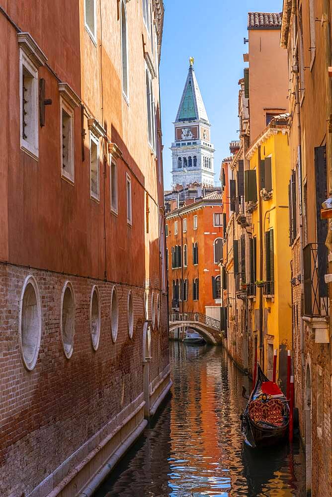 Narrow canal with gondola, view of Campanile di San Marco bell tower, Venice, Veneto, Italy, Europe