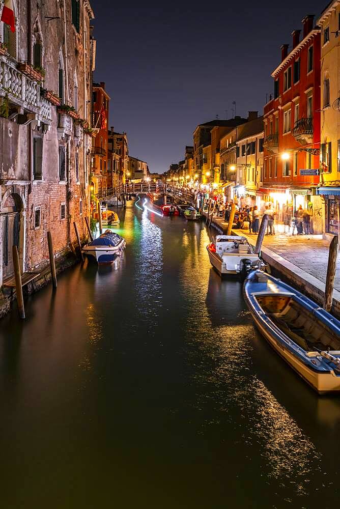 Evening atmosphere, streetlights, canal with boats and historical buildings, light traces, Venice, Veneto, Italy, Europe