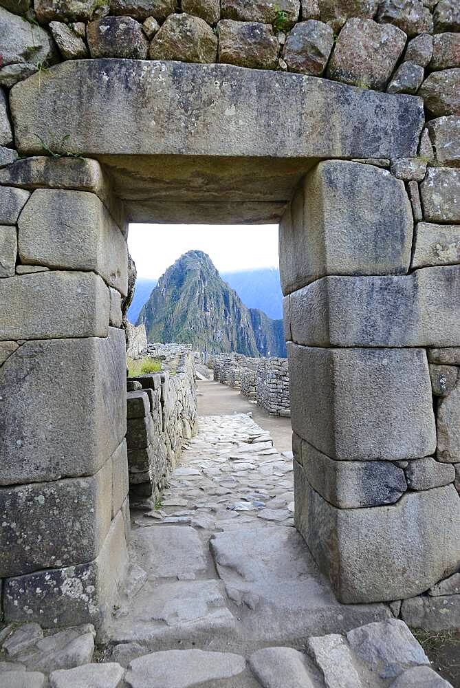 Gate in the ruined city of the Incas at dawn with Mount Huayna Picchu, Machu Picchu, Urubamba Province, Peru, South America