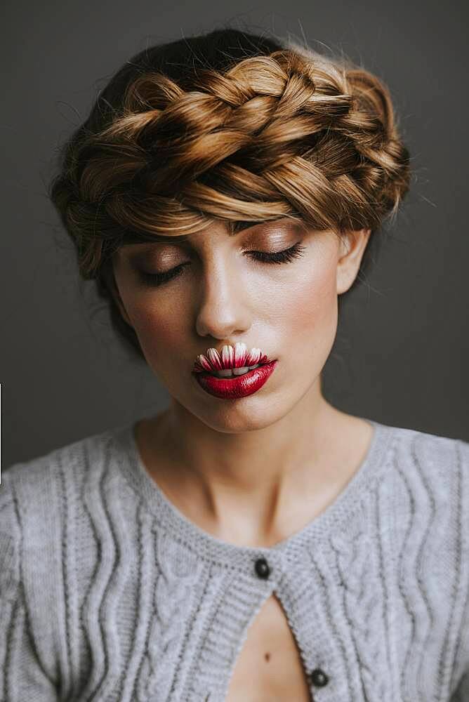 Young woman with flower lips