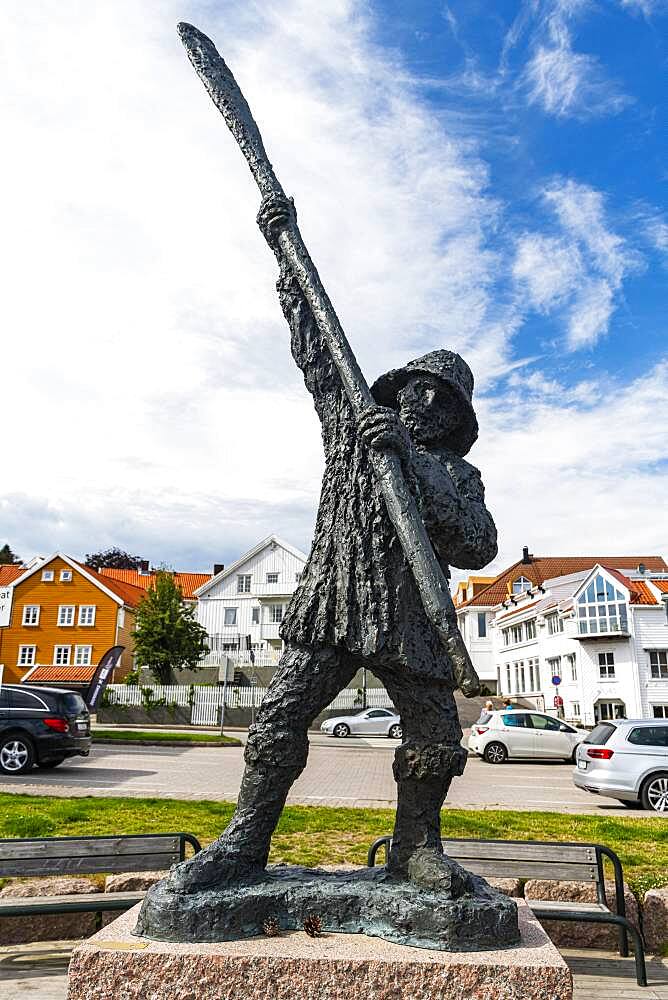 Statue in the harbour of the historic harbour town Grimstad, Norway, Europe