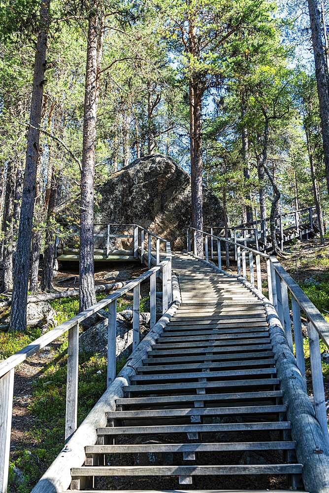 Wooden stairs to the ""Bear's Den"" Tafone Rock, Lapland, Inari, Finland, Europe