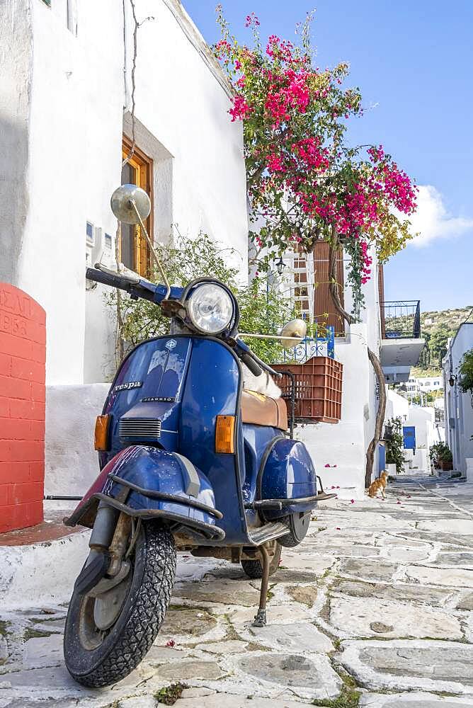 Blue scooter, Vespa, in an alley, Lefkes, Paros, Cyclades, Aegean Sea, Greece, Europe