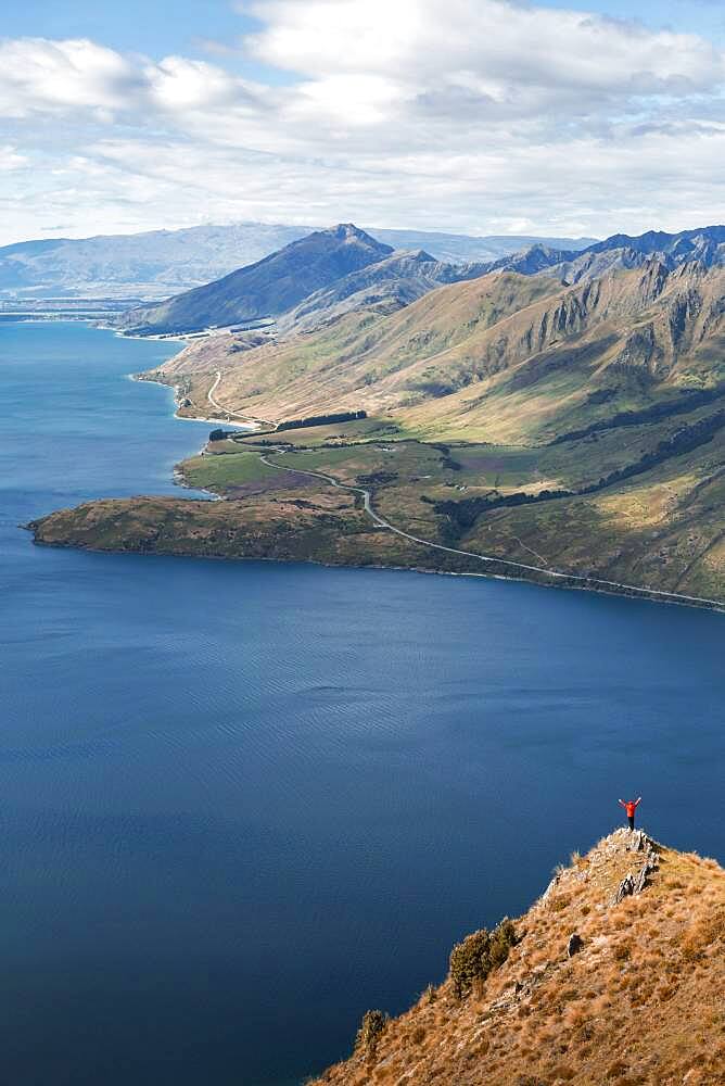 Guy on a mountain at Lake Hawea, Otago Region, Queenstown-Lakes District, South Island New Zealand