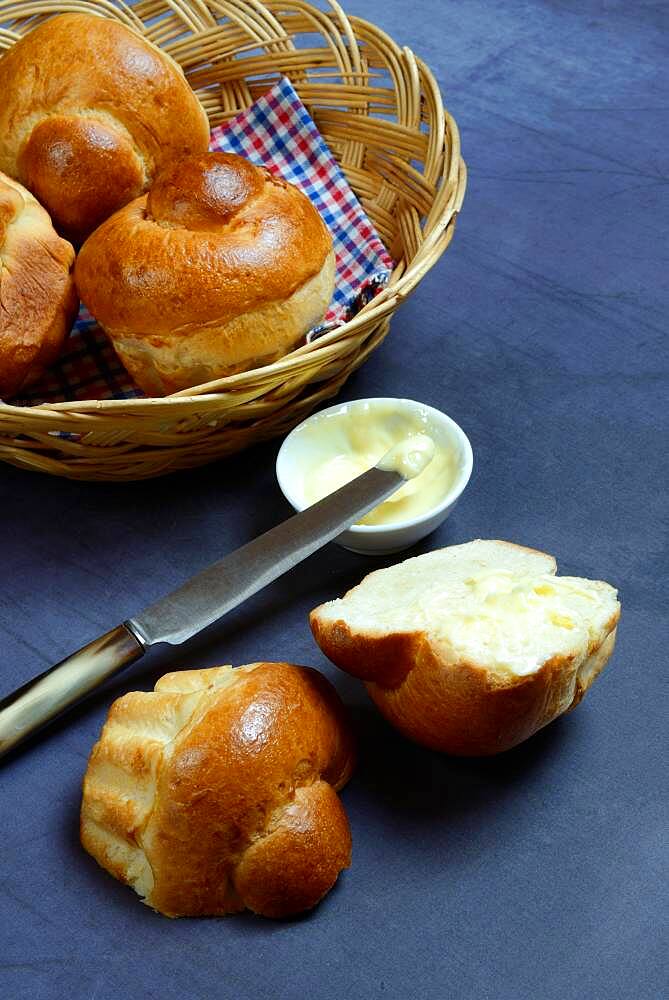 Brioche, brioches in basket and dish with butter, Germany, Europe