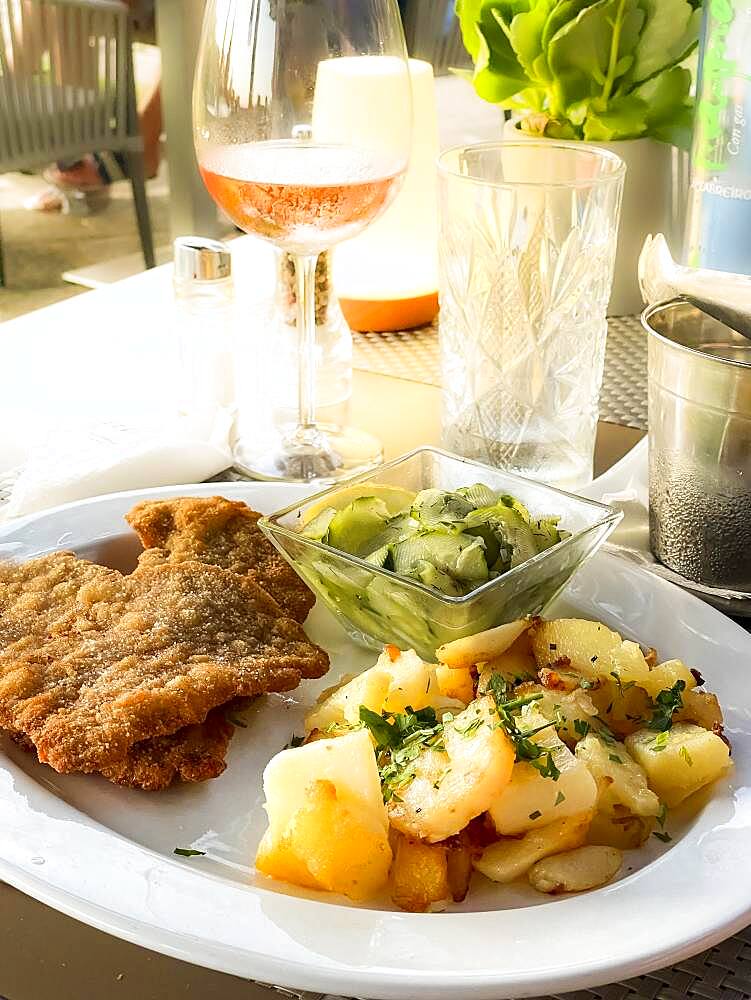 Original Viennese veal escalope with fried potatoes and cucumber salad, Port Andratx, Majorca, Spain, Europe