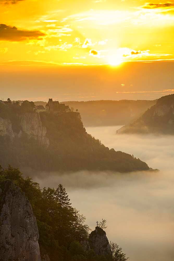 View from Eichfelsen to Werenwag Castle with morning fog, sunrise, near Irndorf, Upper Danube nature park Park, Upper Danube Valley, Danube, Swabian Alb, Baden-Wuerttemberg, Germany, Europe