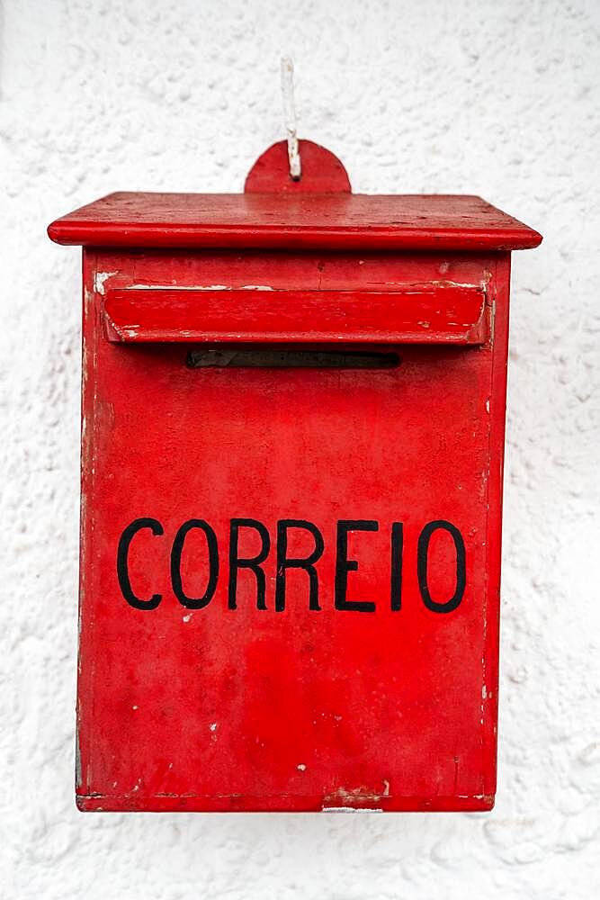 Vintage mail office box with portuguese word ""mail"" on white wall