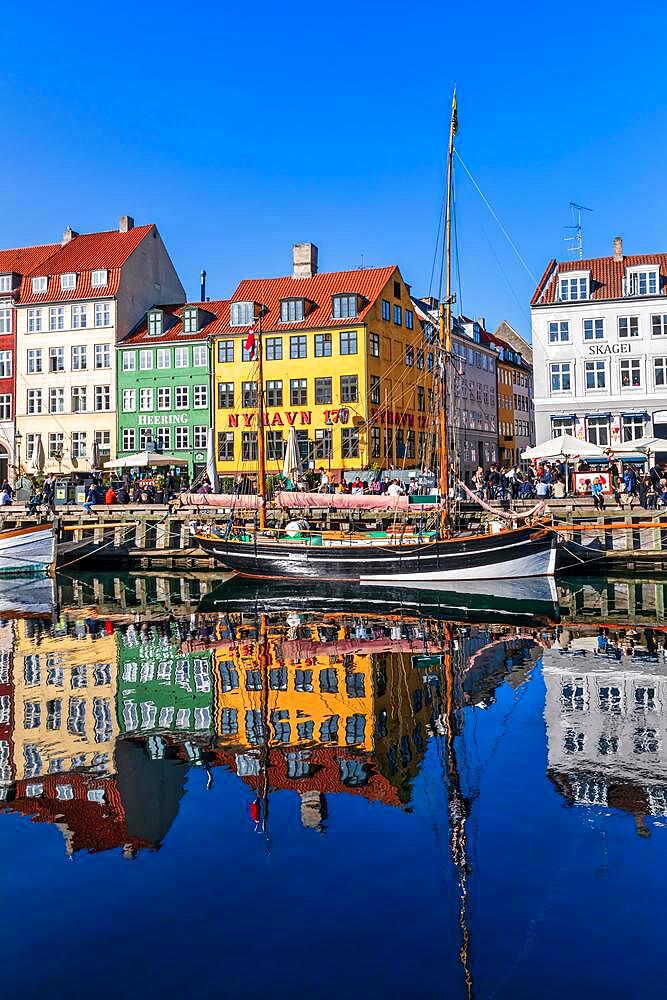 Colored houses and sailing boats on Nyhavn Canal, Copenhagen, Denmark, Europe