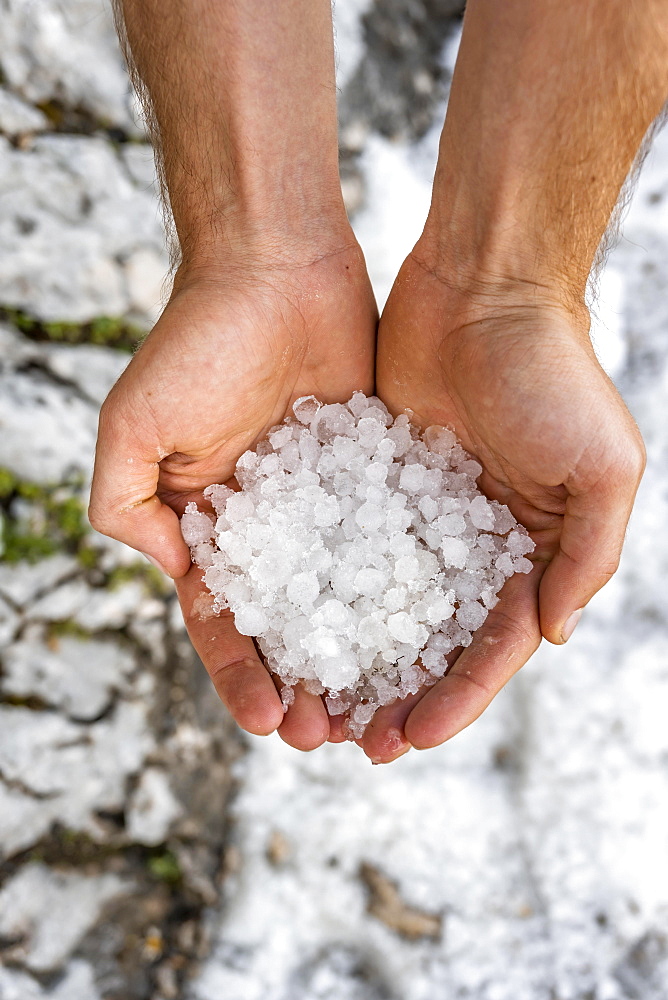 Two hands holding hailstones, hail, storm, Garmisch-Partenkirchen, Bavaria, Germany, Europe