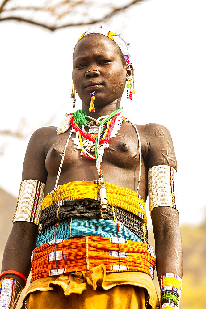 Traditional dressed young girl from the Laarim tribe, Boya hills, Eastern Equatoria, South Sudan, Africa