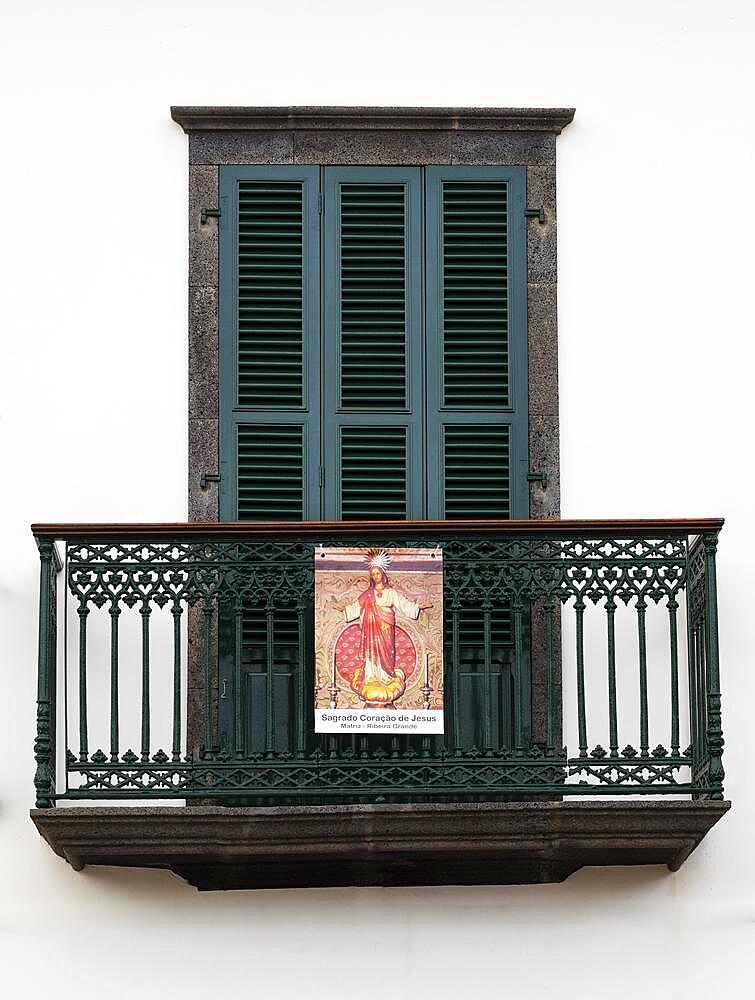 House facade with balcony and image of a saint, Ribeira Grande, Sao Miguel Island, Azores, Portugal, Europe