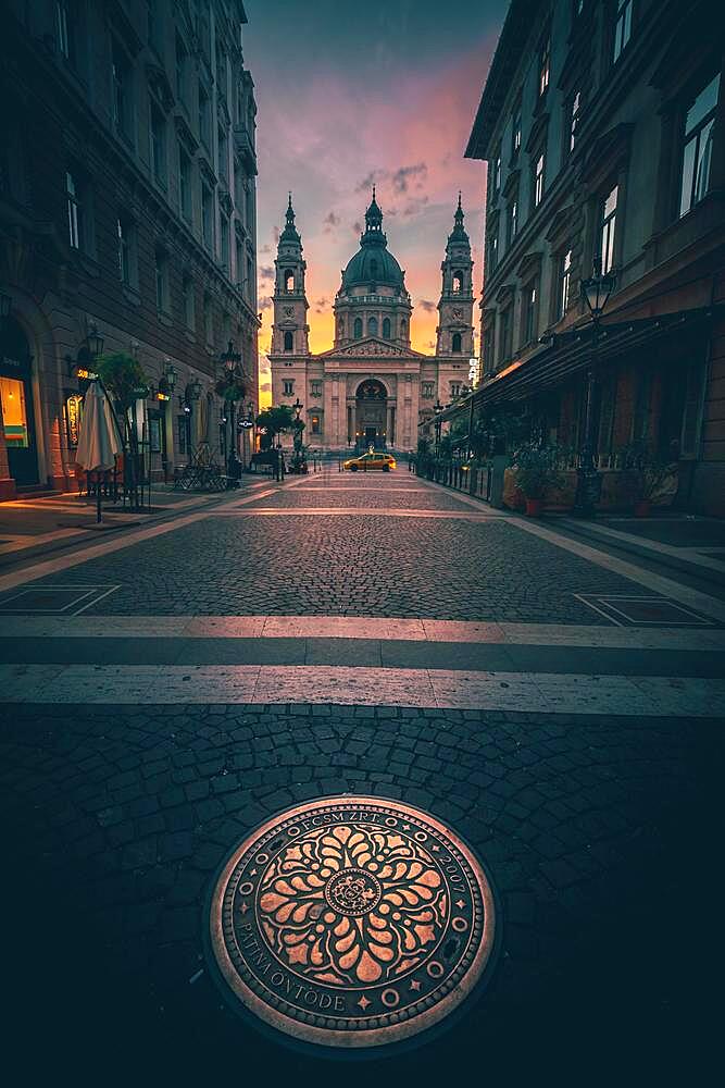 Street view of St. Stephen's Basilica, city view with sun star and sunrise, church, cathedral, Budapest, Hungary, Europe