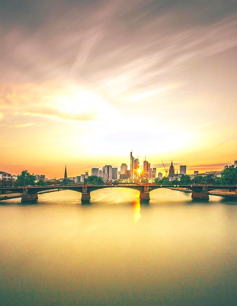 View of Frankfurt and the Frankfurt skyline, Commerzbank, Hessische Landesbank, Deutsche Bank, European Central Bank, Skyper, Sparkasse, DZ Bank, long exposure, sunset, with sunstar, Frankfurt, Hesse, Germany, Europe