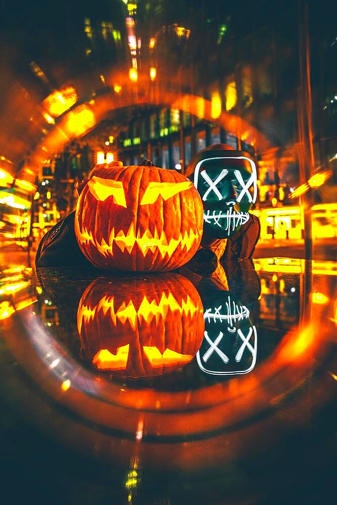 Man with Purge mask with Halloween pumpkin, Frankfurt am Main, Hesse, Germany, Europe