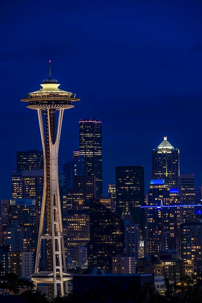 View over illuminated skyscrapers of Seattle, skyline with observation tower Space Needle, blue hour, Seattle, Washington, USA, North America