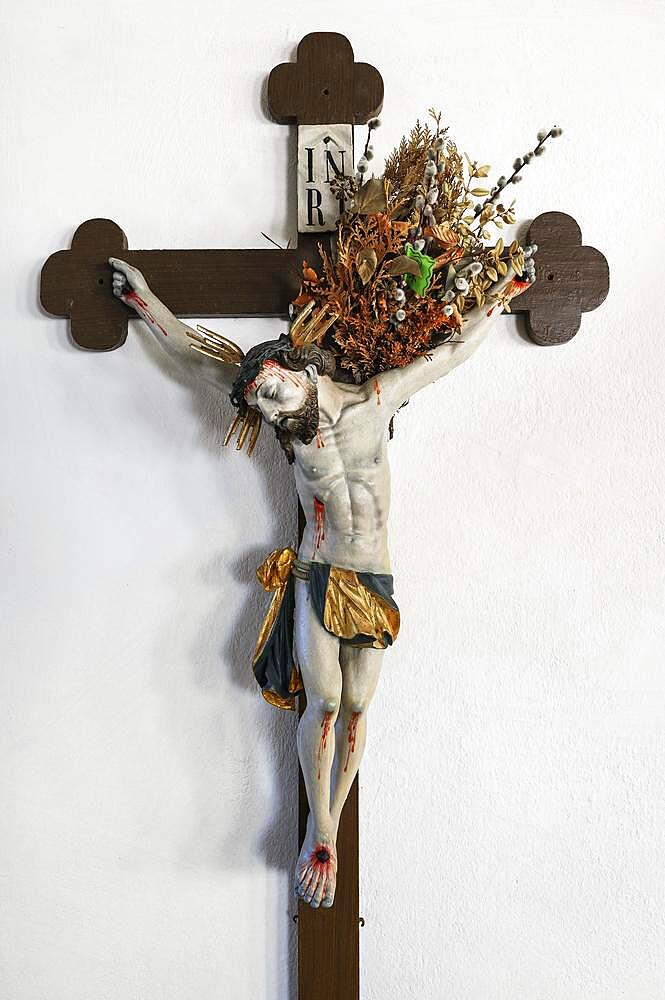 Crucified Christ with ferns and palm catkins, Church of St. Ulrich, Rechtis, Allgaeu, Bavaria, Germany, Europe