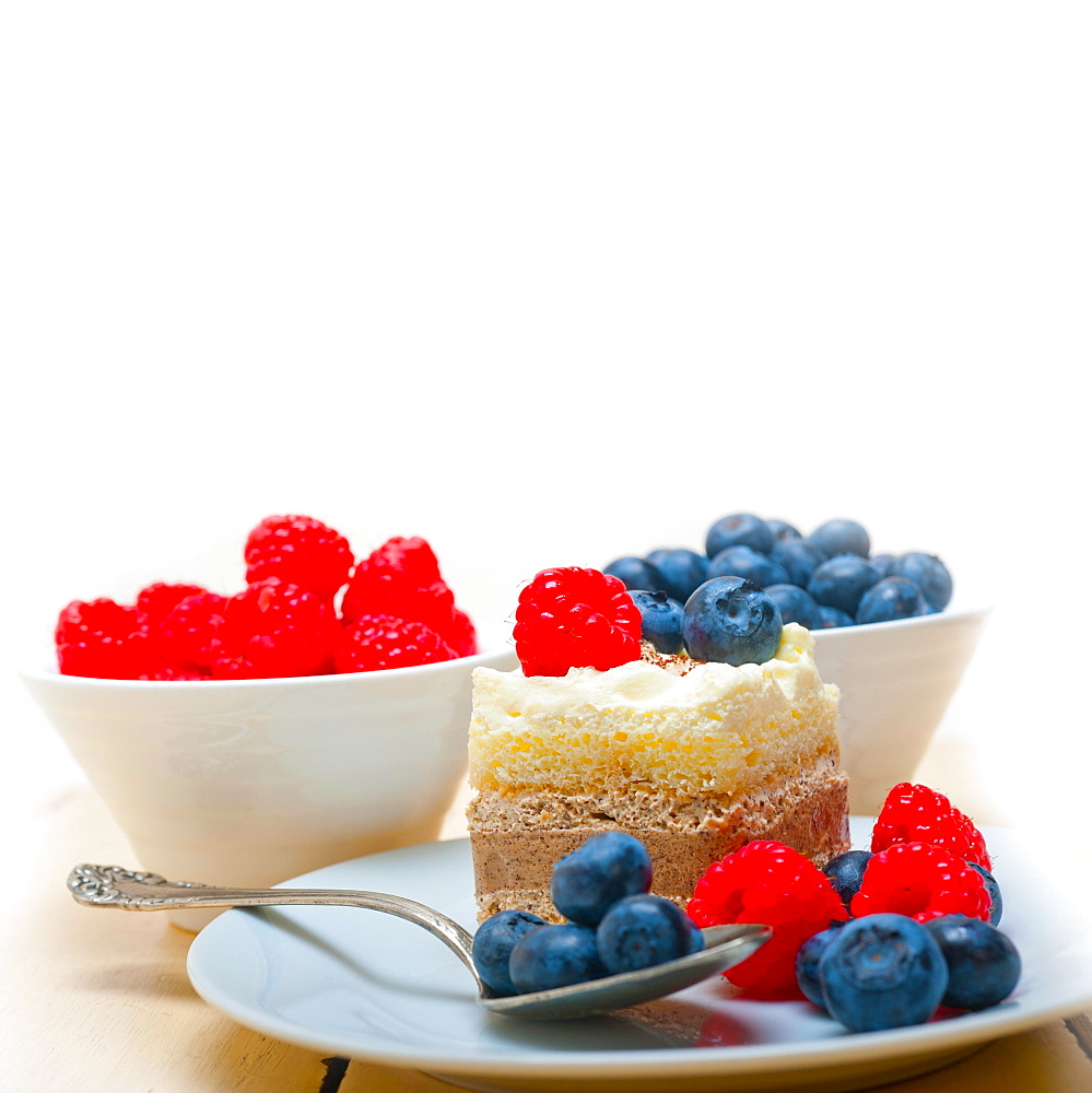 Fresh homemade raspberry and blueberry cream cake