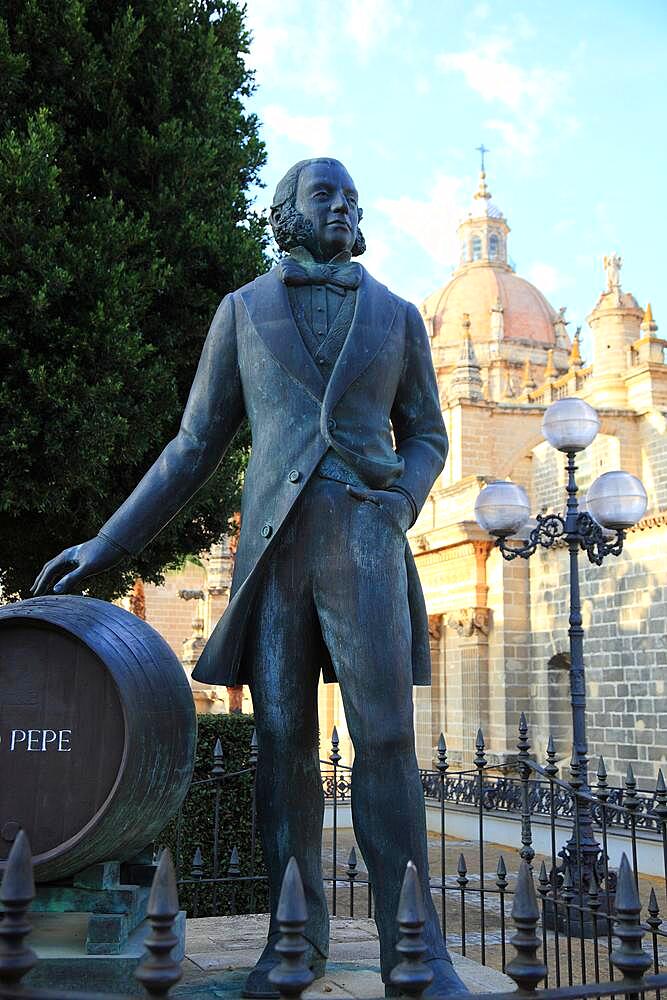 Jerez de la Frontera in the province of Cadiz, statue of Manuel Maria Gonzalez Angel, sherry cask Tio Pepe in front of the cathedral Antigua Colegiata de San Savator, Andalusia, Spain, Europe