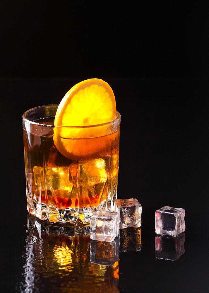 Front view whiskey with orange ice