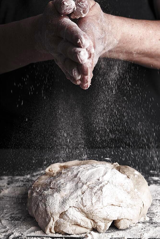 Cooking dough by elderly woman cook hands for homemade pastry bread, pizza, pasta recipe preparation on table background