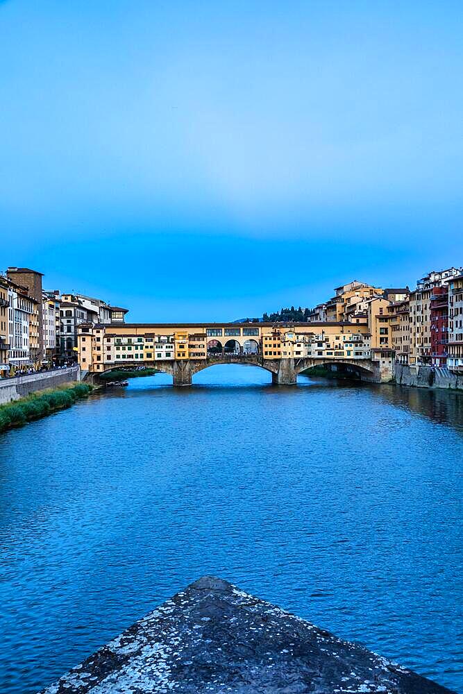 Florence, Italy - Circa June 2021: sunset on Ponte Vecchio - Old Bridge. Amazing blue light before the evening