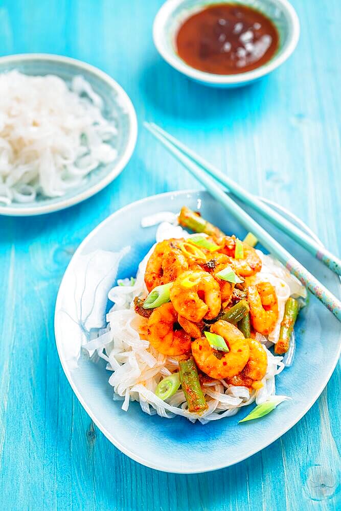 Shirataki (konjak) noodle with shrimps and curry sauce and vegetables. Dietary, Gluten-free and keto diet