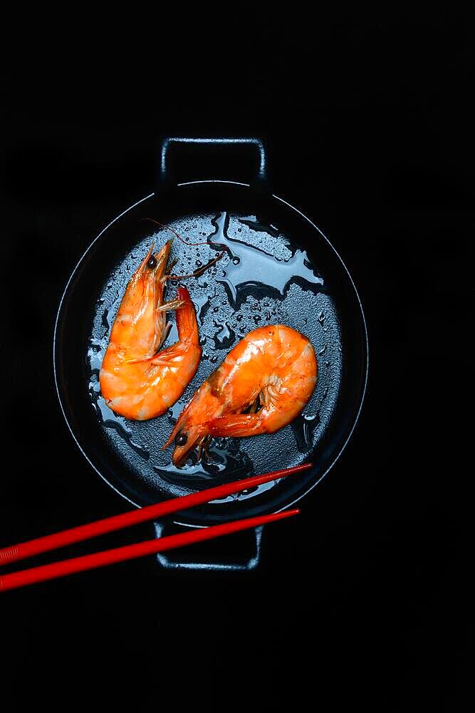 Cooked prawns in pan with chopsticks, prawns, shrimps