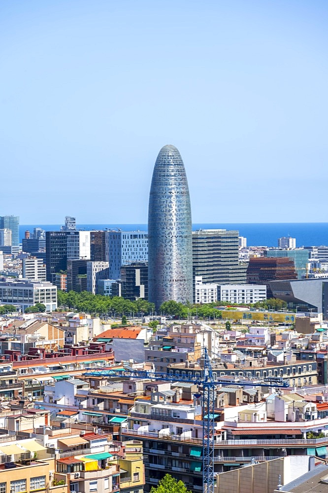 View over the city houses, skyscrapers and Torre Glories, from the Sagrada Familia tower, Barcelona, Catalonia, Spain, Europe