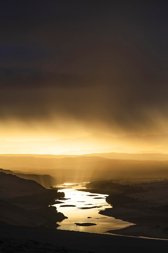 Thunderstorm over the Orange River, also known as the Orange River, on the border between Namibia and South Africa, Oranjemund, Sperrgebiet National Park, also known as Tsau ǁKhaeb National Park, Namibia, Africa