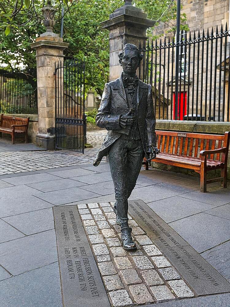 Life-size statue of the Scottish poet Robert Fergusson in front of Canongate Kirk, Royal Mile, Edinburgh, Scotland, United Kingdom, Europe