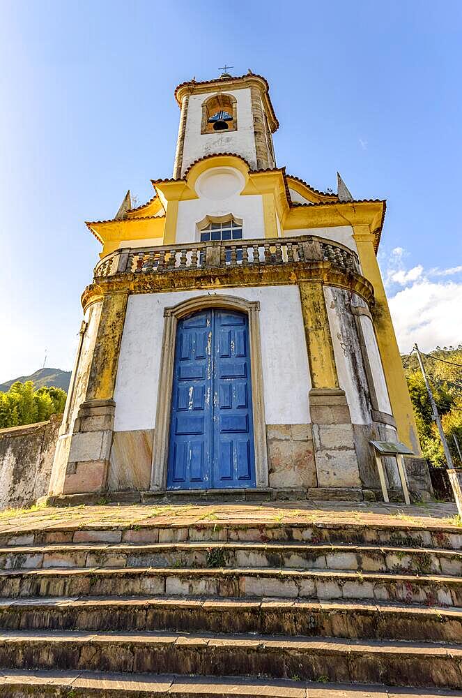 Historic church with its stairs, bell and tower in the city of Ouro Preto in Minas Gerais seen from below, Brasil