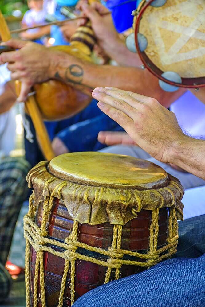 Dum player and other instrumentalists during a Brazilian samba performance at the carnival, Brasil