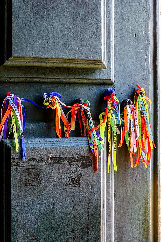 Famous colorful ribbons of good luck from Our Lord of Bonfim tied to the door of the church in Salvador, Bahia, Brasil