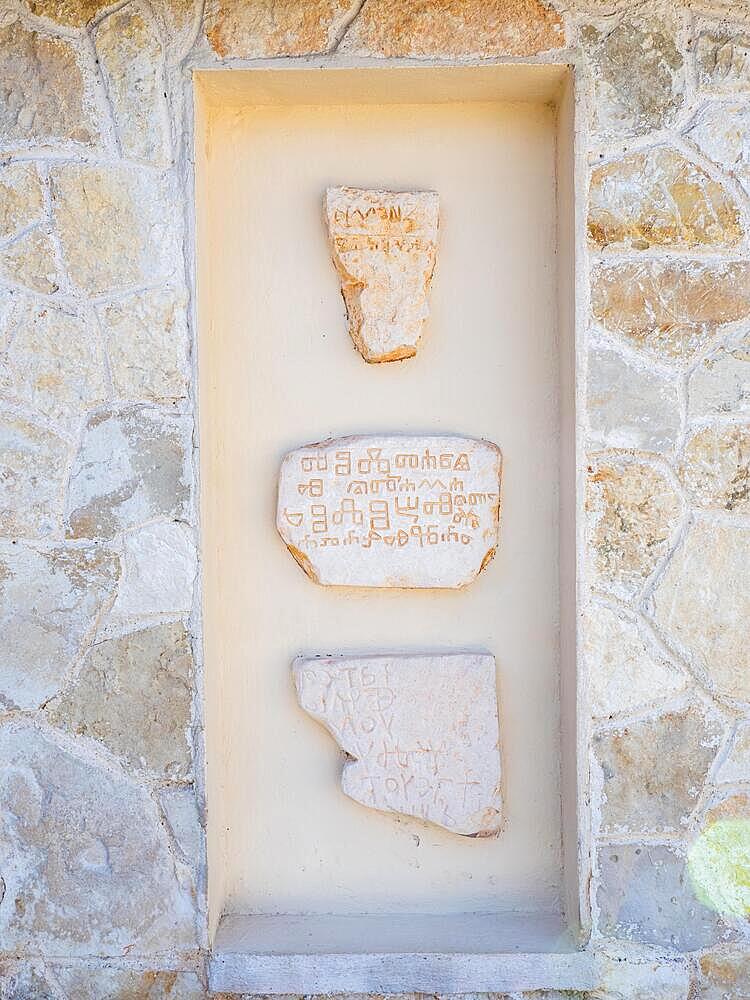 Stone tablet with old Croatian writing, fishing village Valun, Cres Island, Adriatic Sea, Kvarner Bay, Croatia, Europe