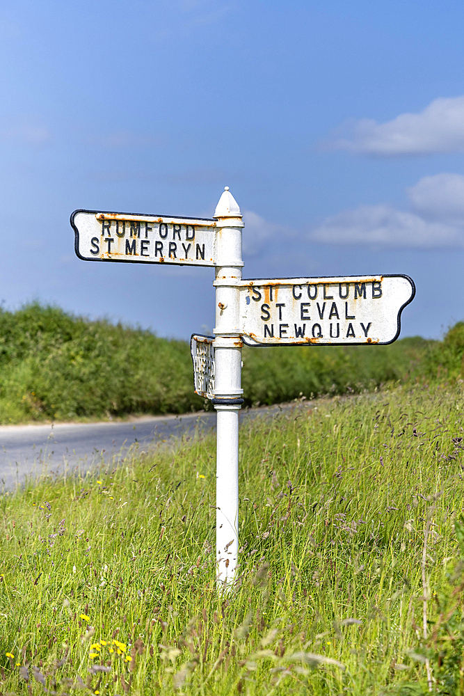 Old signposts with place names on a country road in North Cornwall, England, Great Britain