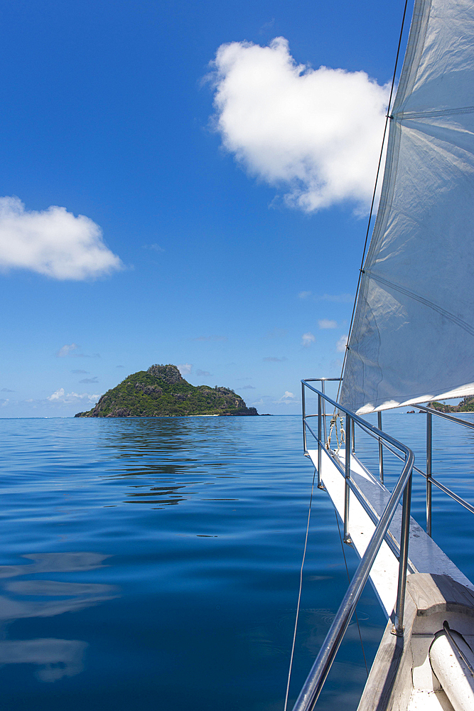 Sailing in the very flat waters of the Mamanuca islands, Fiji, Oceania