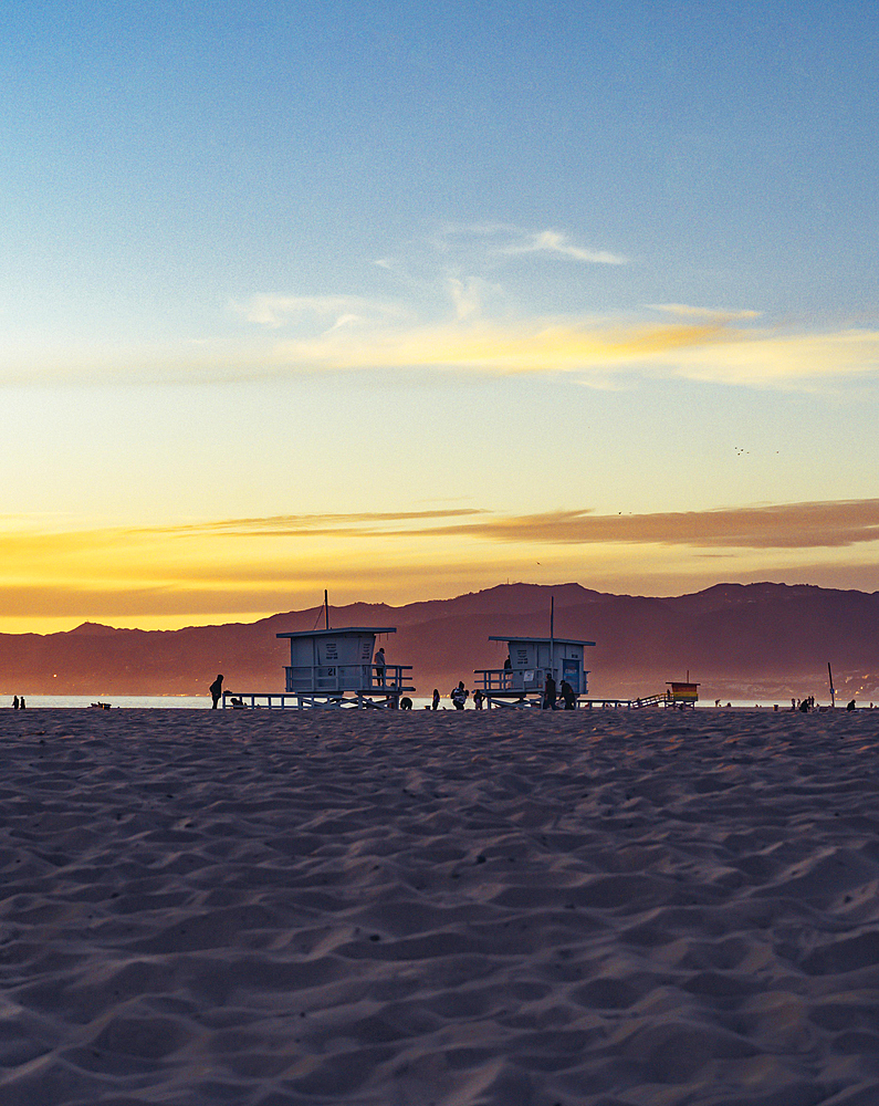 Venice Beach, California, United States, March 15 2022: Two californian lifeguard towers at sunset, North America