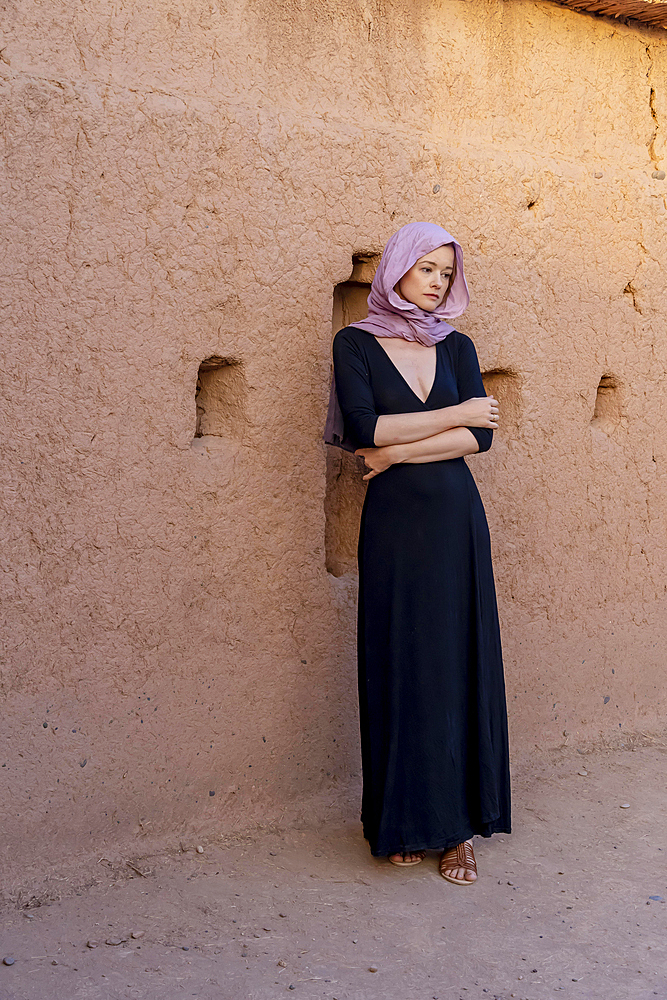 A beautiful model wears a hijab in the middle of the Sahara desert