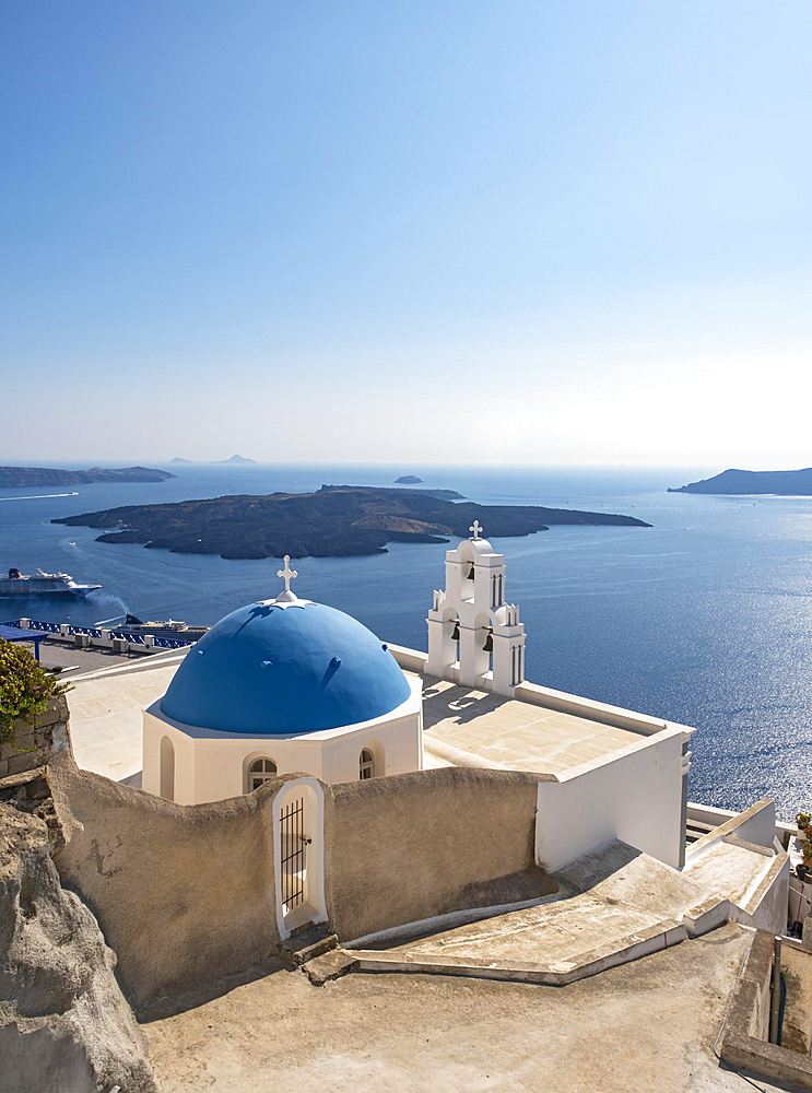 Three Bells of Fira, Iconic blue-domed church and belfry with sea view, Catholic Church of Dormition, Firostefani, Santorini, Greece, Europe